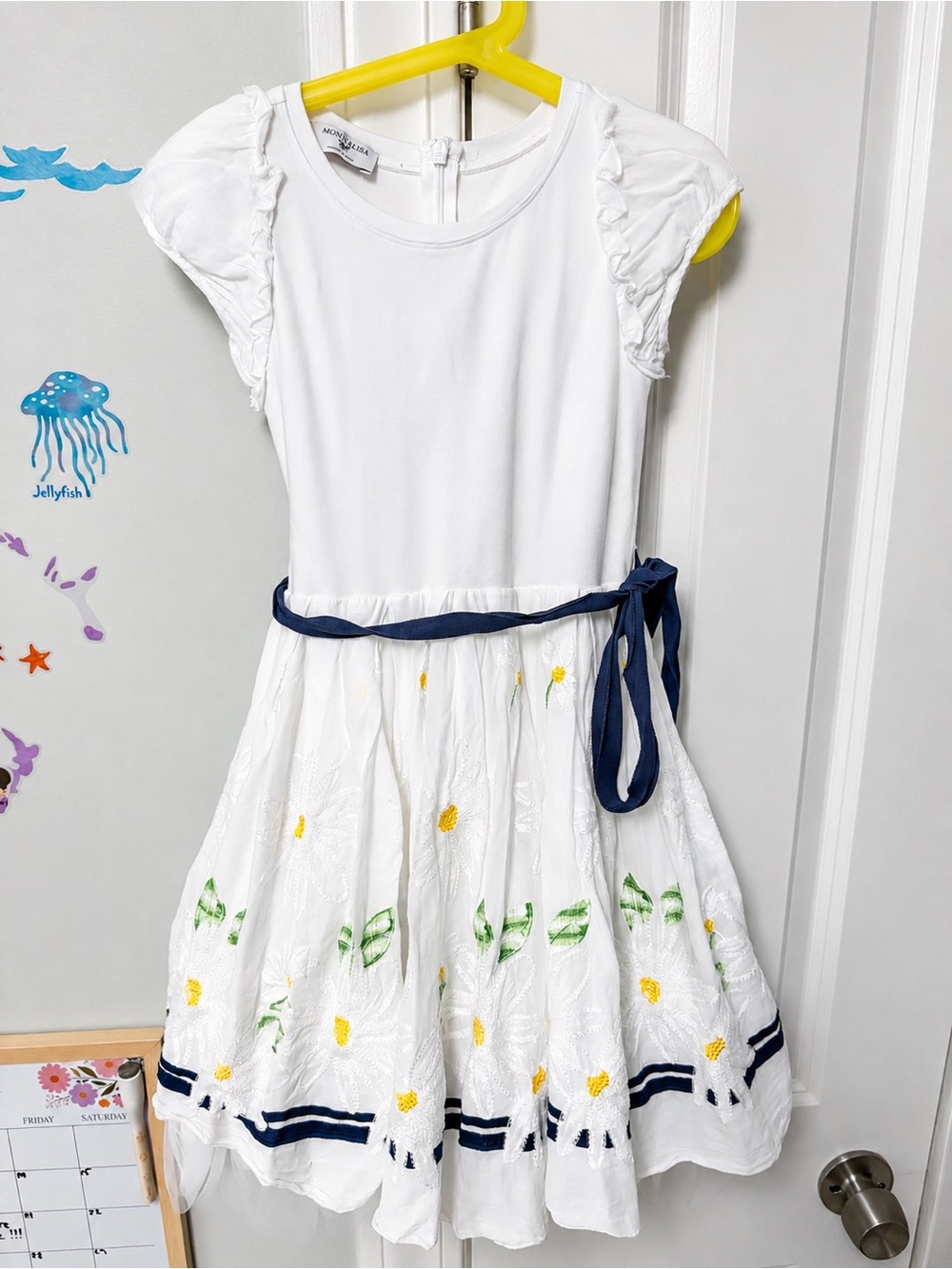 MonnaLisa White Dress with Navy Sash and Yellow Floral Accents